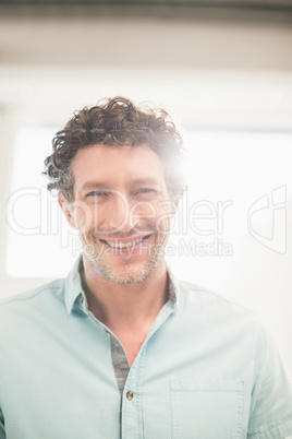 Casual businessman smiling at camera