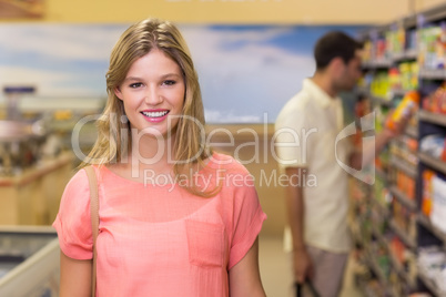 Portrait of pretty blonde woman buying products