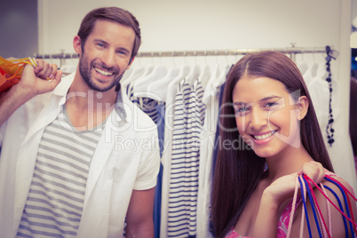 Portrait of smiling couple with shopping bags