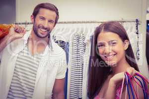 Portrait of smiling couple with shopping bags