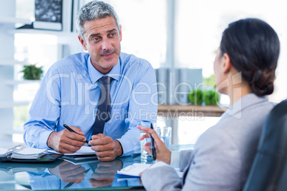 Happy business people shaking hands