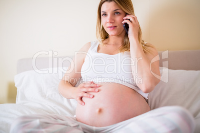 Pregnant woman having phone call