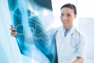 Female doctor examining x-ray