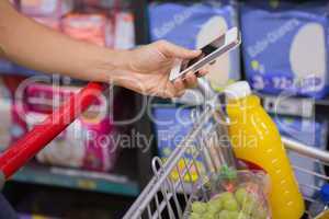 woman buy products and using his smartphone