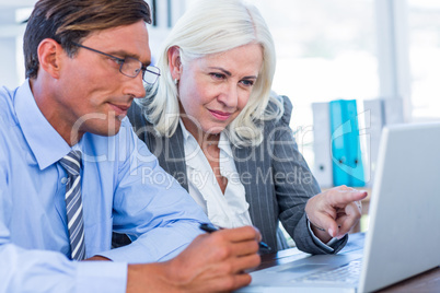 Business people working on laptop computer