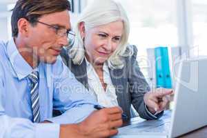 Business people working on laptop computer