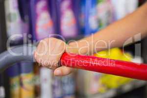 Woman buy products with her trolley