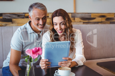 Couple using digital tablet