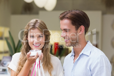 A couple testing a sample of beauty products