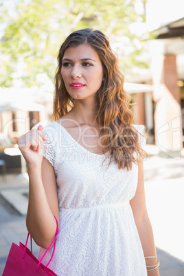 Smiling woman with shopping bag