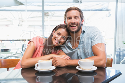 Young happy couple looking at camera