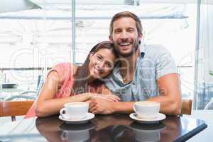 Young happy couple looking at camera