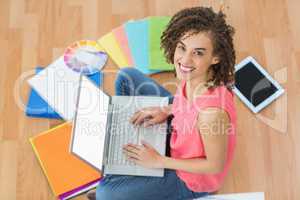 Young creative businesswoman working on laptop