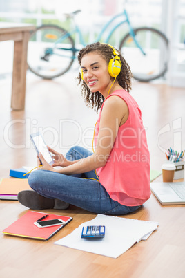 Young creative businesswoman holding a tablet