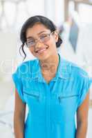 Smiling casual businesswoman working with photos