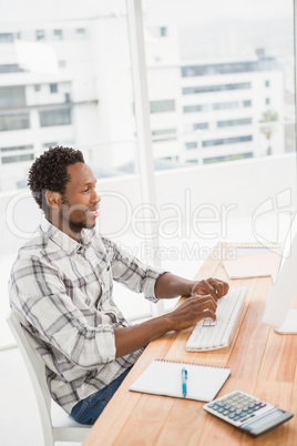 Young businessman sitting at his desk