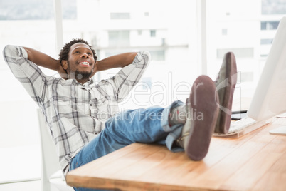 Young businessman sitting at his desk