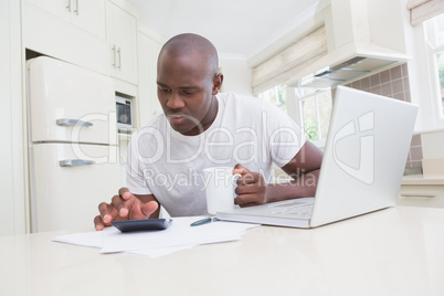 A man working and using his laptop