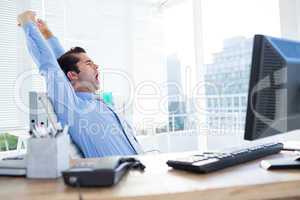 Businessman yawning and stretching