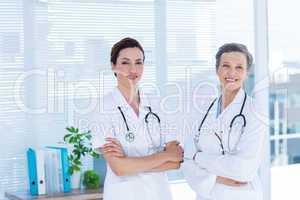 Portrait of smiling medical colleagues with arms crossed