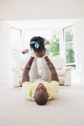 Happy smiling father holding her daughter