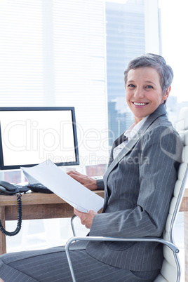 Smiling businesswoman using computer