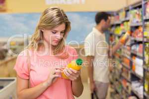 Pretty blonde woman buying product