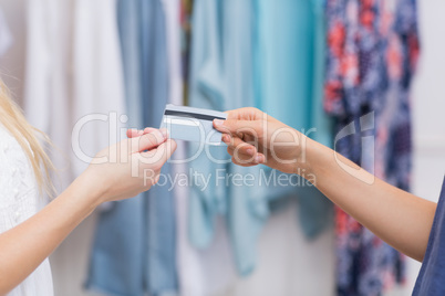 Girls handing a credit card