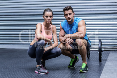 Muscular couple looking at the camera