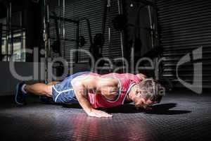 Muscular man doing push-ups