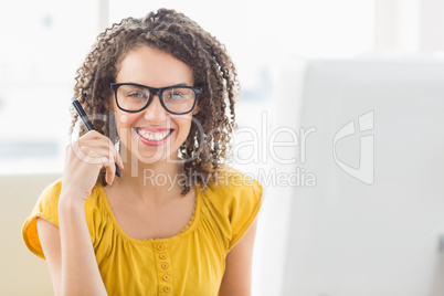 Creative young businesswoman looking at the camera