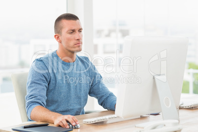 Young creative businessman working on the computer