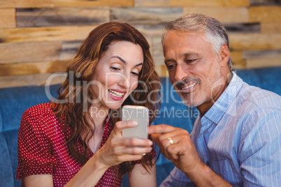 cute couple looking at their phones