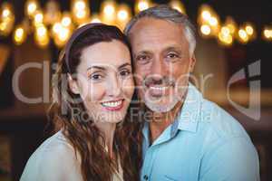 Portrait of happy couple smiling at camera