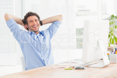 Casual businessman using computer in office