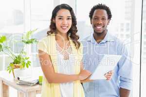 Young smiling business people looking at the camera