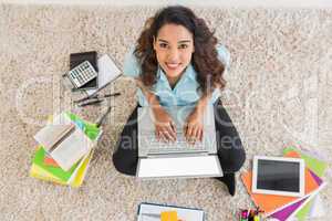 Young businesswoman typing on the laptop
