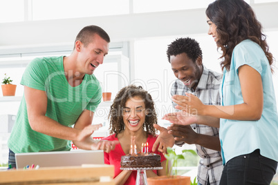 Smiling colleagues celebrating birthday