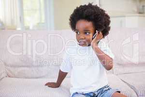 Little boy using a technology and phoning