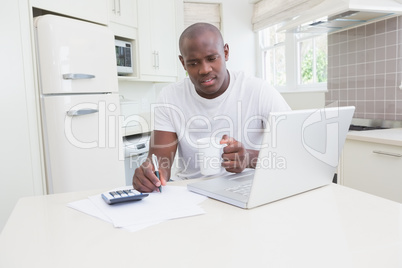 A man working and using his laptop