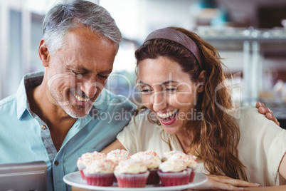 Cute couple looking at cakes