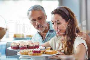 Cute couple looking at pastries