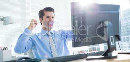 Cheerful businessman cheering in office