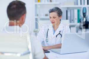 Female doctor speaking with her patient