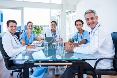 Team of smiling doctors having a meeting