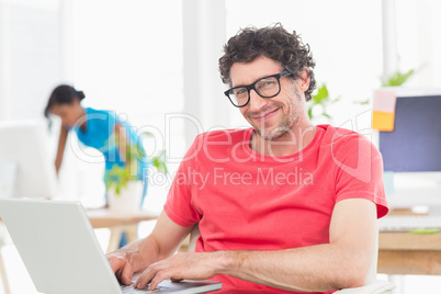 Man posing in front of his colleague