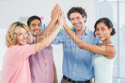 Casual business team high fiving