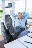 Businessman relaxing in a swivel chair
