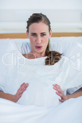Portrait of pregnant woman suffering from pain