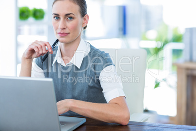 Businesswoman working on laptop computer